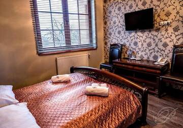 Фото номера Двухместный номер Делюкс с 1 кроватью Отель Hotel Polonia г. Острув-Велькопольски 9